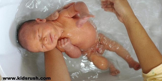 The first bath of a newborn baby